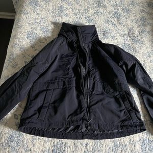 Lululemon womens size 6 jacket in navy. Water repellent with hidden hood.